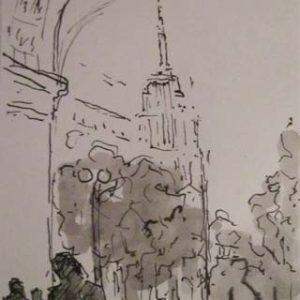 Empire state building through Washington arch (New York)